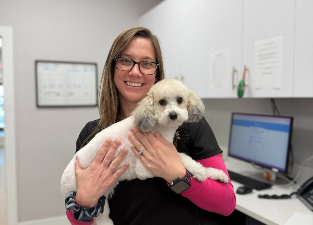female veterinarian with dog