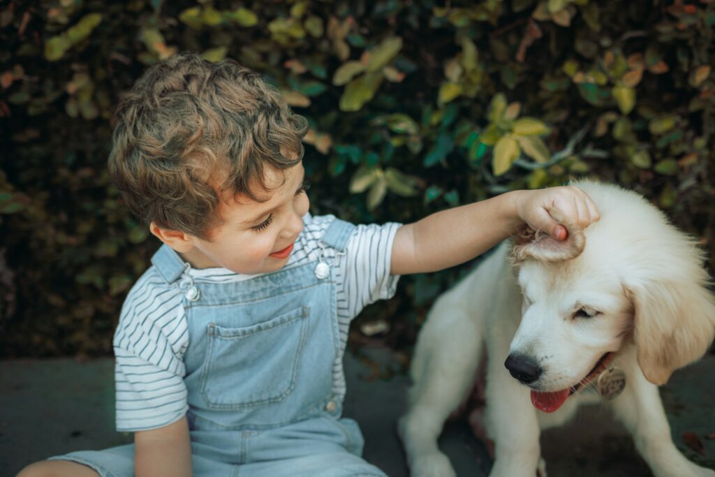 child meeting a puppy